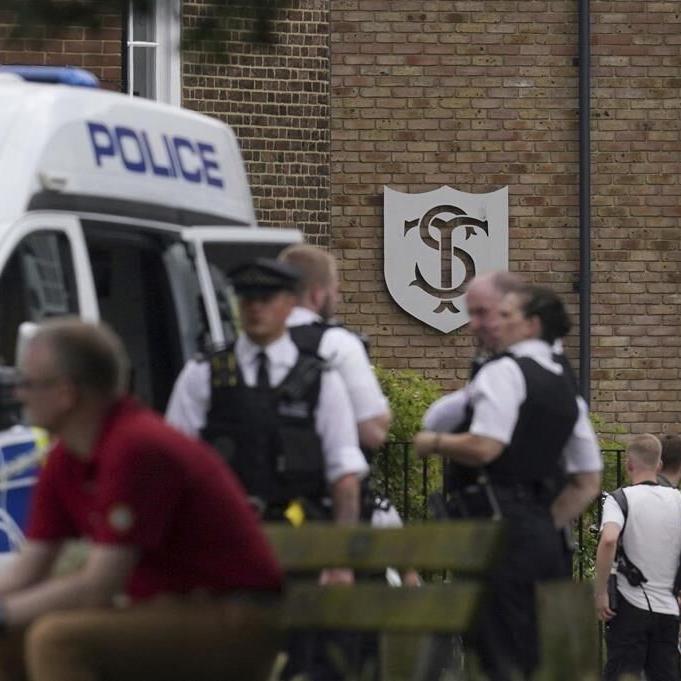 An SUV crash at a London school kills an 8-year-old girl. A woman is arrested for dangerous driving